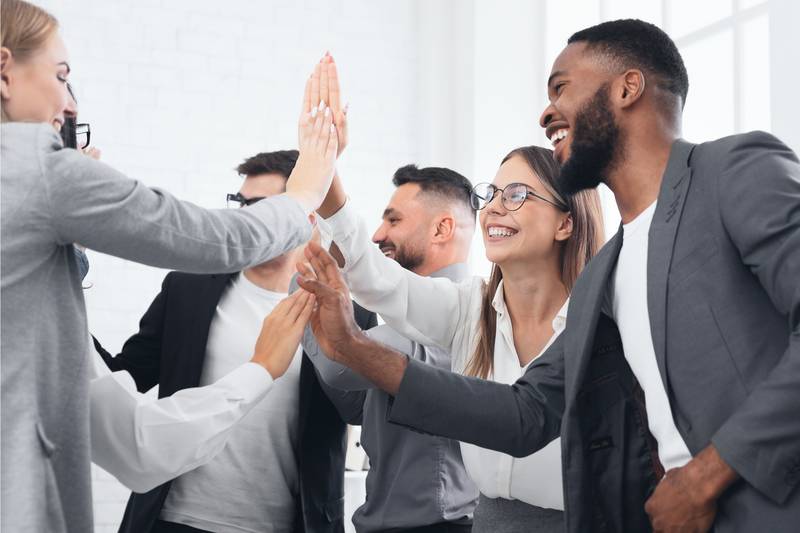 Business team exchanging high-fives